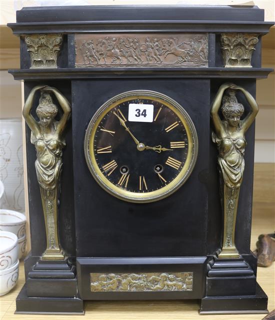 A black slate and gilt metal mantel clock